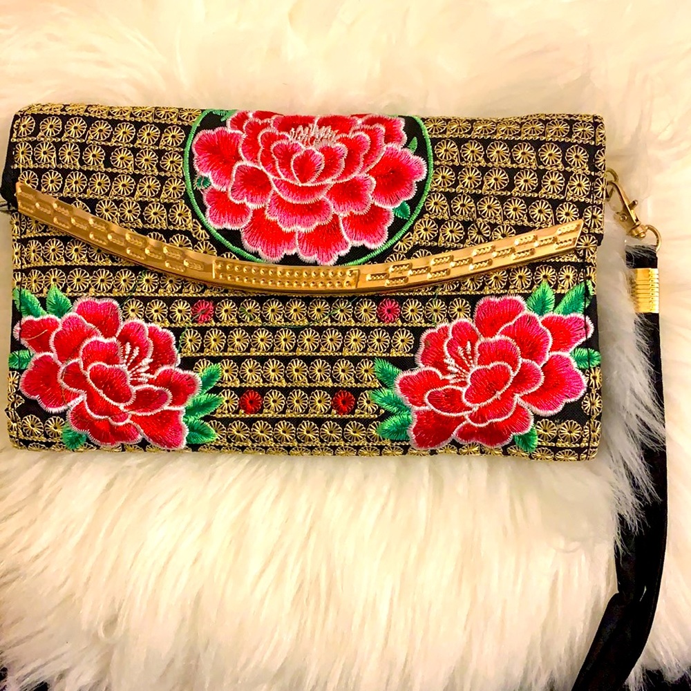 Hand stitched clutch